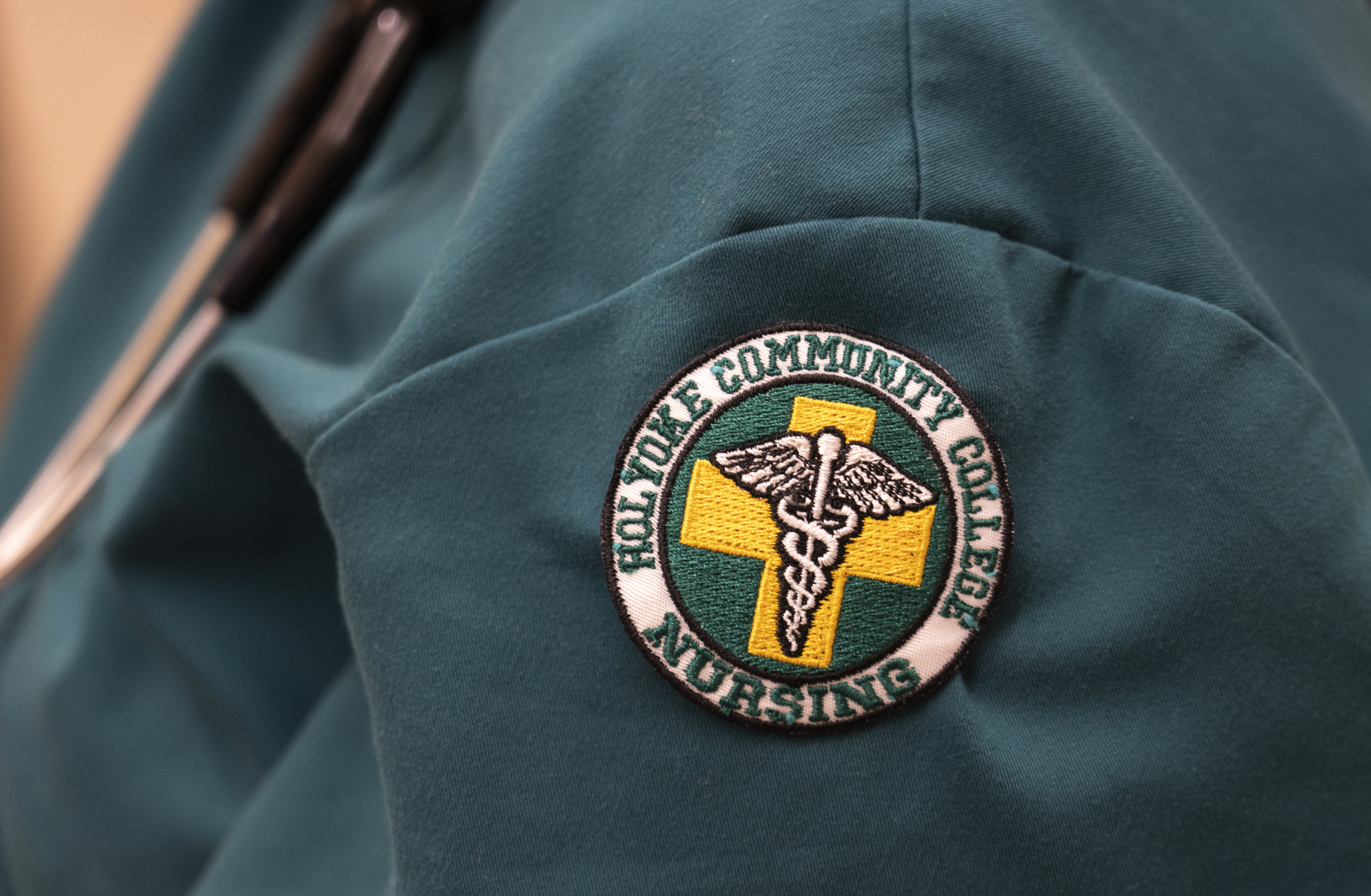 A closeup of the HCC nursing patch on a student's scrubs